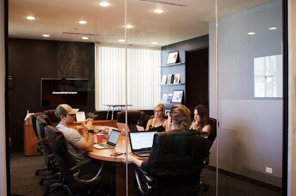 A team meeting in a small, modern conference room